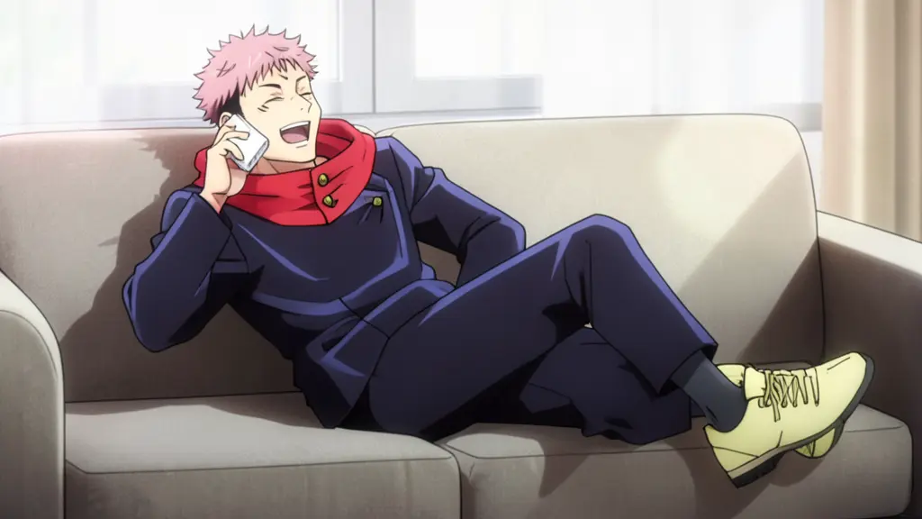 Yuji Itadori laying on the sofa, laughing, when talking on the white smartphone near his ear, bright daylight.